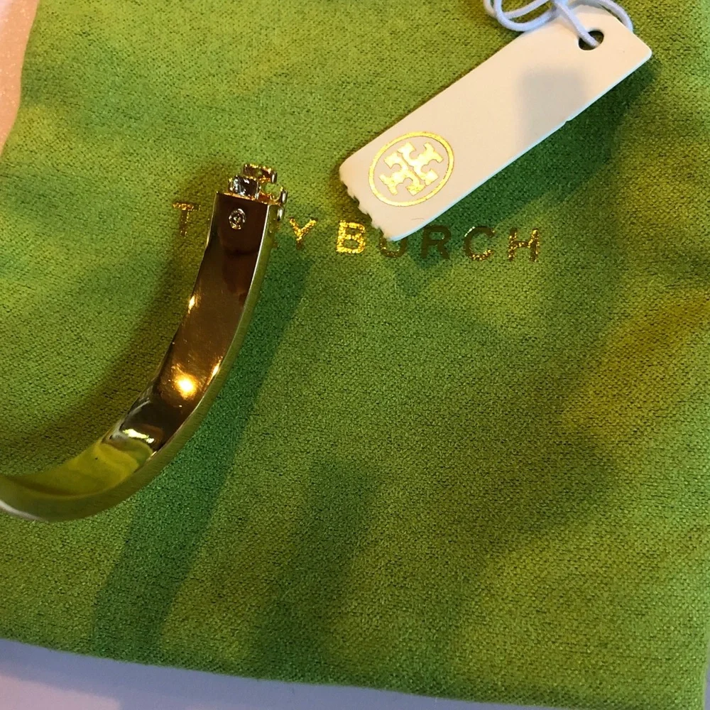Authentic Tory Burch New/tag and pouch. Enamel Floral Hinge gold tone bracelet.